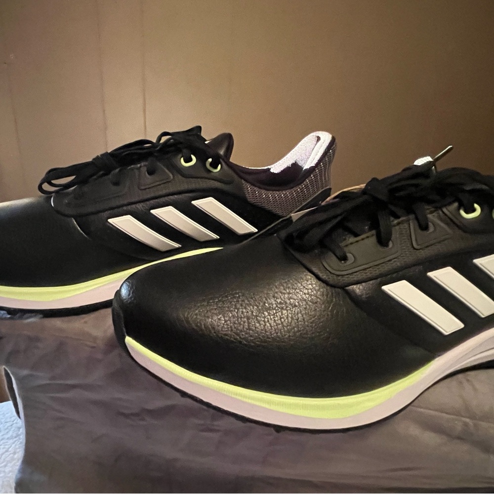adidas Men’s Black Athletic Shoes with White Stripes and Neon Accents